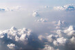 © Vladimir Razgulyaev - The background is textured dramatic blue-white clouds in the sky, the view from the window of a samsolet. Fantastically beautiful natural background, a peaceful and peaceful scene of real nature.