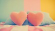 © 锴 张 - Two pink heart-shaped pillows resting on a neatly made bed against a soft pastel-colored wall, creating a cozy and romantic atmosphere.