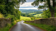 © Sekai - Serene rural road flanked by historic stone walls and vibrant lush greenery under open skies