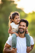 © Shivani - happy indian daughter enjoying on father shoulder