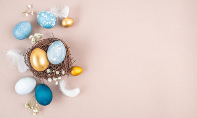 Wall Mural - decorations, easter eggs in a nest on a beige background. happy easter flat lay concept.
