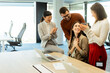 © BGStock72 - Team celebrates success together in a bright modern office environment