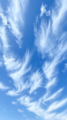 Naklejka na meble Whispy white clouds against a clear blue sky