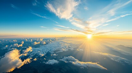 Poster - The sky is blue with a few clouds scattered throughout. The sun is shining brightly, casting a warm glow over the clouds. The scene is peaceful and serene
