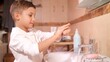 © treephwood - Young boy is carefully rubbing his hands together under a stream of water, ensuring that he is clean after using the toilet