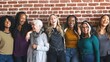 © Rawpixel.com - Diverse group of women smiling and standing together against a brick wall. They appear happy and connected, showcasing friendship and diversity. Diverse group of women united, standing together.