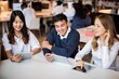 © Rawpixel.com - Students studying together in a library, using tablets. Diverse group of young adults collaborating and engaging with technology in an academic setting. Diverse high school students at library.