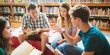 © Rawpixel.com - Group of young adults studying in a library, discussing notes, and collaborating on a project. Diverse group engaged in learning and teamwork. Diverse high school students at library.