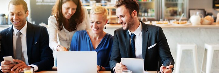 Wall Mural - group of professionals in a meeting, discussing work. diverse team collaborating, using laptops and 