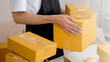 © ภาคภูมิ ปัจจังคะตา - SME and packaging delivery concept. Small entrepreneurs are preparing packages to send to customers. Starting Small business entrepreneur SME freelance. Online business, Work at home concept.