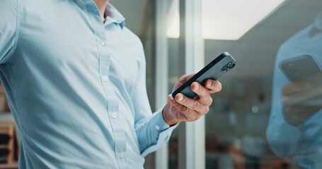 Fototapete - Hands, phone and texting by window in office with reflection, contact and notification on web at startup. Business person, chat or click on mobile app, social media or networking at creative agency