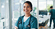 © peopleimages.com - Nurse, woman or arms crossed with portrait at hospital for healthcare service, clinic care and medical support. Medicine professional, happy doctor and stethoscope for health treatment and about us