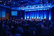 © peshkova - Blurred audience at a professional business conference in a large hall.