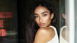 © JuanM - Captivating portrait of a woman with long hair in a stylish urban setting