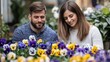 © Preecha - A young couple planting flowers in their garden, nurturing growth metaphor, copy space included,
