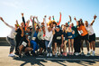 © Jacob Lund - Group of diverse runners celebrating after a community event