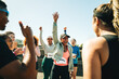 © Jacob Lund - Group of friends cheering after completing a marathon together