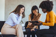 © Dragana Gordic - Three Women Collaborating in a Discussion with a Tablet During a Meeting