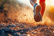 © gankevstock - Dynamic trail runner kicking up dust in natural sunlight