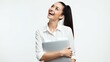 © IWonderStudio - Smiling woman in white shirt holding laptop looking upwards in a joyful portrait style
