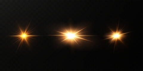 Wall Mural - golden shining light effect.bright sun sparkles with stars and sparkles.