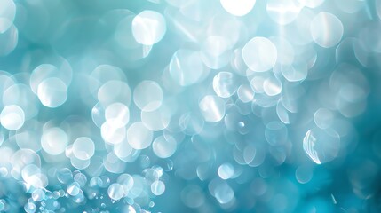 Wall Mural - abstract bokeh background with blurred circles of light in shades of blue and white.