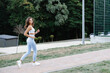© nazariykarkhut - Young sportswoman running in the park enjoying her workout