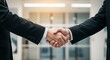 © GS-Studio - Deal is sealed: A firm handshake signifies a successful business partnership, agreement, or greeting. Symbolizing collaboration, trust, and mutual respect in a modern office environment.