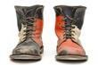 © ChaoticMind - Unique pair of worn work boots showcasing contrasting colors and textures, symbolizing hard labor and resilience