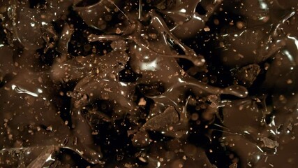 Poster - Super Slow Motion of Falling Group of Chocolate Chunks. Moving Down and Splashing into Melted Chocolate. Filmed on High Speed Cinema Camera, 1000fps.