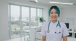 © IbragimovN - Smiling nurse in modern medical office with stethoscope