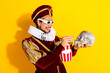 © deagreez - Humorous portrayal of a medieval nobleman enjoying modern cinema in a colorful parodic setting