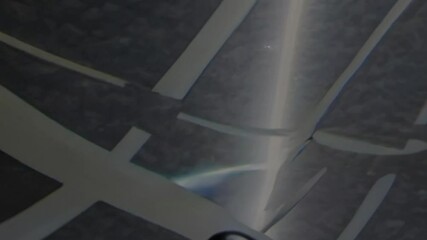 Wall Mural - close-up of a glimmering, metallic-inspired surface featuring iridescent waves and textures, reflect