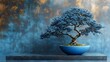 © Linus - A blue bonsai tree is sitting in a blue bowl on a black pedestal