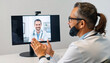 © MariusAdrian - Doctor having a video conference with another doctor