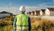 © Stefan Schurr - civil engineer stands looking at the construction site