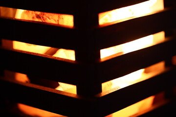 Wall Mural - Close-up shot of flames burning in a grill.