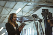 © Wavebreak Media - In factory, woman using tablet and headset, managing operations efficiently, copy space