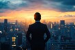 © VibrantLens - Businessman gazing at the city skyline during sunset.