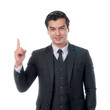 © suphaporn - Confident young businessman in a sleek black suit pointing upwards with a friendly smile, conveying a successful business idea or innovative solution, isolated on a transparent background