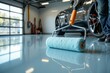 © RESTY - A person rolling paint on the epoxy garage floor carefully