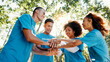 © FremeFlex/peopleimages.com - Volunteer, team or people stack hands for support, donation goal or cooperation in low angle outdoor. Huddle together, community service or group at charity NGO, smile or motivation for collaboration