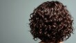 © Fotograf - A portrait of a woman's curly hair at the back of her head