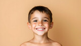 Smiling Boy Portrait Against Light Beige Background