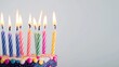 © Haider - Decorative birthday candles placed on white background with copy space