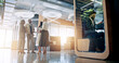 © peopleimages.com - Lobby, pod and business people in office talking for collaboration, teamwork or discussion. Professional, corporate and men meeting women with cubicle for private workspace for project or proposal