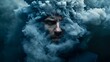 © Tai - Man surrounded by a cloud of smoke creating an enigmatic atmosphere while engaging in a reflective moment