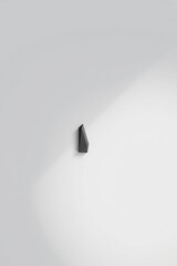 Wall Mural - Minimalist wall decor showcasing a geometric black sculpture on a white wall providing a modern touch