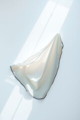 Wall Mural - Flowing fabric draped elegantly in soft light creating a minimalistic aesthetic