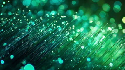 Leinwandbilder - Abstract green fiber optic cables glowing in the dark, creating a bokeh effect.
